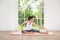 Young woman in sportswear doing meditation practice and yoga indoor, healthy lifestyle, Mental health concept