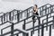 Young woman in sportswear jogging on stadium stairs