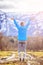 Young woman in sportswear is standing on a field, wonderful-gesture