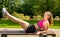 Young woman sporty girl with pink top workout outdoor