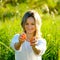 Young woman squeezing orange