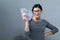 Young woman with a stack of cash USD