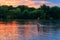 Young woman on stand up paddle board paddleboard, SUP paddleboarding along the Dnieper river at sunset