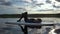 Young woman on a stand up paddle board relaxing