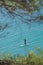 Young Woman Stand Up Paddle Boarding