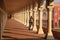 Young woman standing in colonnade walkway leading to Diwan-i- Khas in Agra Fort, Uttar Pradesh, India