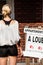 Young Woman standing in front of her new apartment