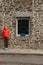 young woman standing near old stone building mont saint