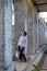 A young woman standing among the stone columns in Paddington Reservoir Gardens, Sydney, Australia