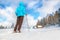 Young woman standing on traill in winter scenery