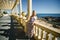 A young woman stands on the Atlantic waterfront. Porto, Portugal.