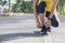 A young woman stopped to tie a string while running in the stadium, Fitness woman runner tying shoelace before running