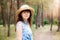 Young woman in straw boater hat in summer