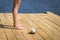 Young Woman stretching on cedar dock