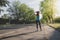 Young woman stretching in the park before running. Exercising outdoor