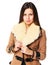 Young woman in stylish in beige sheepskin coat