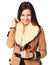 Young woman in stylish in beige sheepskin coat