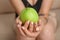 Young woman with stylish manicure holding apple, closeup