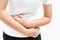 Young woman suffering from abdominal pain feeling stomachache, symptom of pms on white background