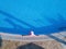 Young woman sunbathing in a swimming pool