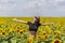 Young woman on a sunflowers field