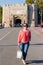 Young Woman With Sunglasses Walking on the Bridge in the Middle of the Street