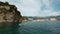 Young woman on the sup board near a cliff