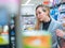 Young woman in the supermarket choose food