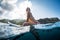 Young woman on the surf board