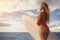 Young woman with surfboard