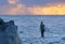 Young Woman Surfer Looking at Ocean