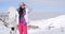 Young woman surveying the snow mountain slopes
