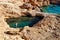 Young woman swim in Pissina of Koufonissi, Greece