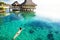 Young woman swimming in a coral lagoon