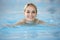 Young Woman Swimming In Pool