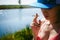 Young woman in swimsuit in snapback on her head