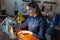 Young woman tailoring on the sewing machine