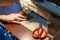 Young woman tailoring on the sewing machine