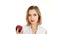 A young woman takes a bite of an apple. Video on white background
