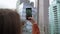 Young woman takes a photo on a mobile phone of skyscrapers in New York.