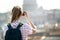 Young woman takes a picture of Saint Peter Cathedral