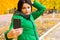 Young woman taking an autumn selfie