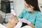 Young woman taking beauty procedure in spa salon