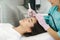 Young woman taking beauty procedure in spa salon. Electrophoresis