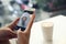 Young woman taking coffee picture with smartphone
