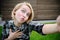 Young woman taking a outdoors selfie