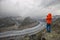 Young woman taking photos at the Aletsch glacier in the Swiss Alps, Europe