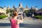 Young woman taking picture of Catalan Art Museum (MNAC)