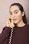 Young woman talking on a land line telephone