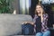 Young woman talking on phone and smiling in cafe